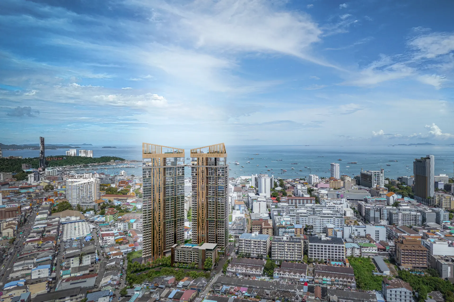 Daytime aerial visualization of Grand BayView twin towers above central Pattaya and Pattaya Bay
